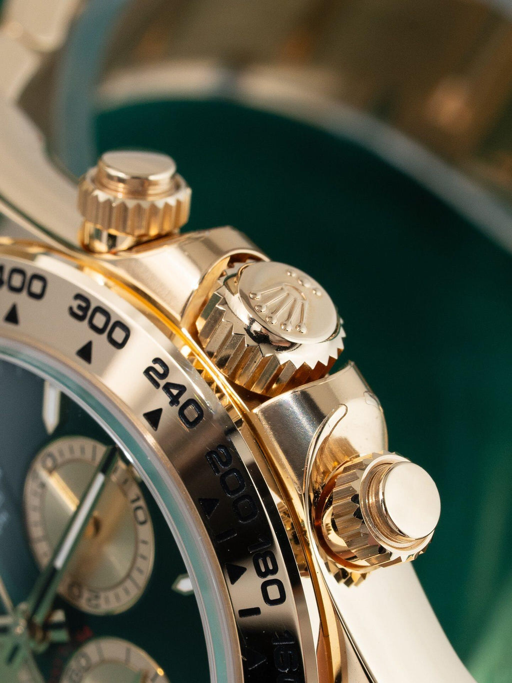 Rolex Cosmograph Daytona Green dial with gold strap